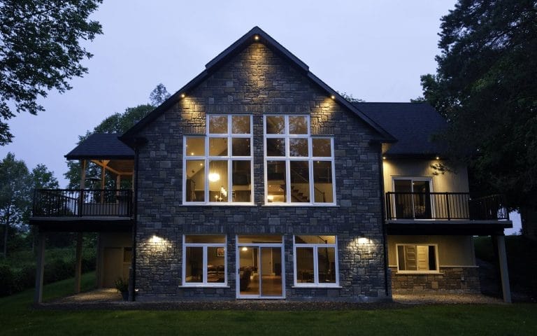 Toronto doors and windows showcases a widows and door installation on a house with a large stone building